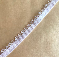 
              Scalloped elastic in White
            