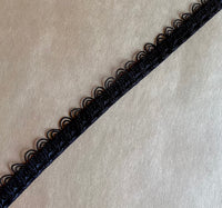 
              Scalloped elastic in black
            